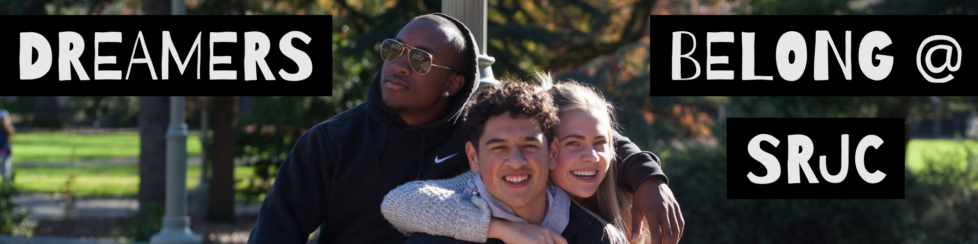 students with arms around each other; text: "DREAMERS BELONG @ SRJC"