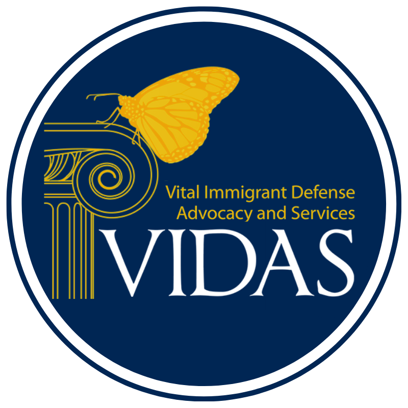 Butterfly resting on a column, "Vital Immigrant Defense Advocacy and Services (VIDAS)"